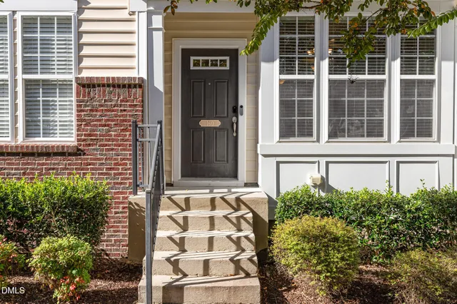 a view of a building with potted plants
