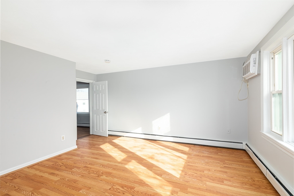 185 Lewis Street, Unit 4 Lynn, MA 01902 - Photo 4 of 20 a view of an empty room with a window