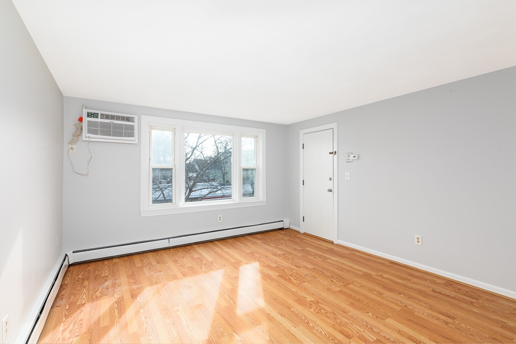 185 Lewis Street, Unit 4 Lynn, MA 01902 - Photo 5 of 20 an empty room with a window