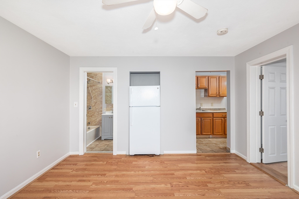 185 Lewis Street, Unit 4 Lynn, MA 01902 - Photo 9 of 20 a view of an empty room with closet and a window