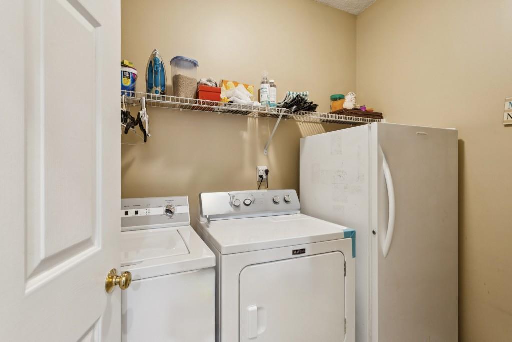 4815 Tanners Spring Drive Alpharetta, GA 30022 - Photo 18 of 45 a utility room with dryer and washer