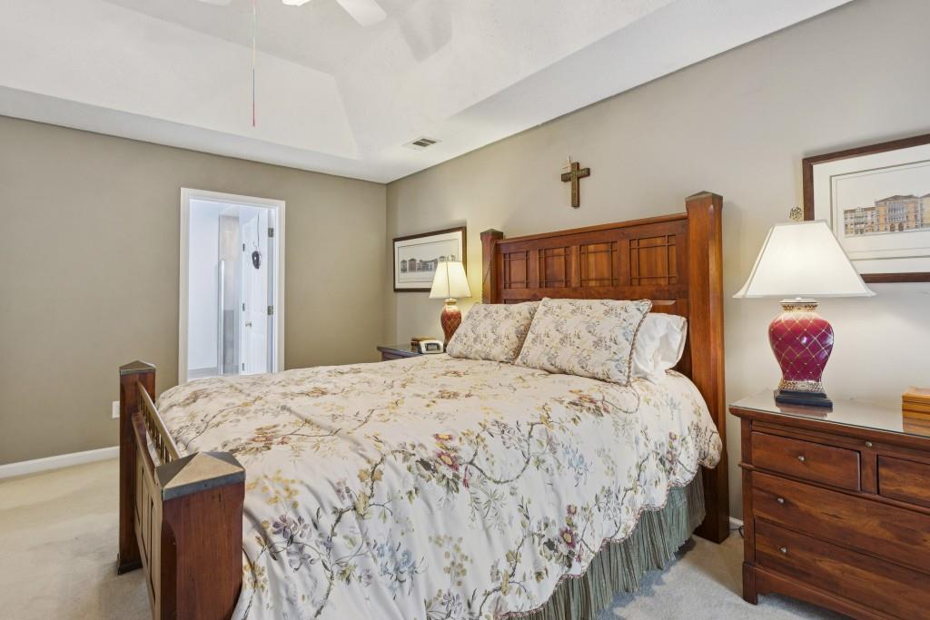 4815 Tanners Spring Drive Alpharetta, GA 30022 - Photo 23 of 45 a bedroom with a bed and wooden floor