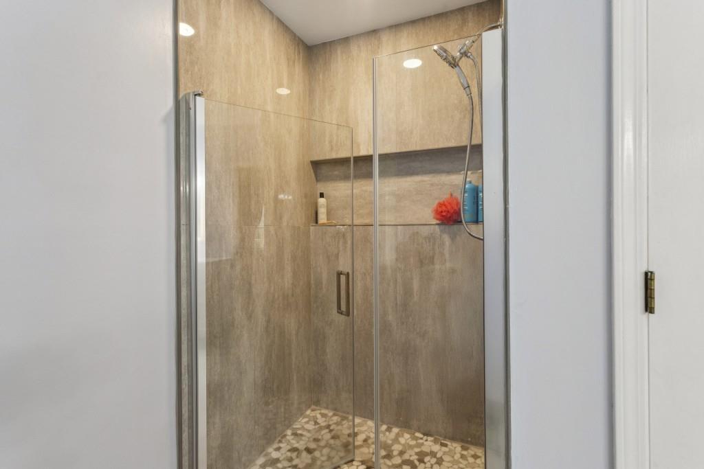 4815 Tanners Spring Drive Alpharetta, GA 30022 - Photo 26 of 45 a bathroom with a shower