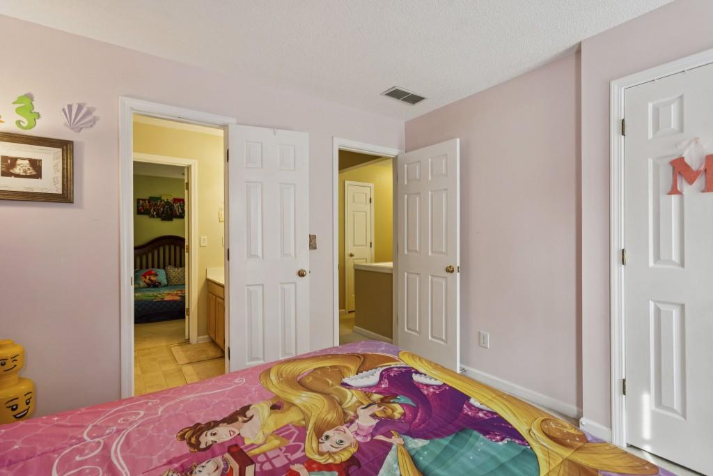 4815 Tanners Spring Drive Alpharetta, GA 30022 - Photo 28 of 45 a bedroom with a bed and a closet