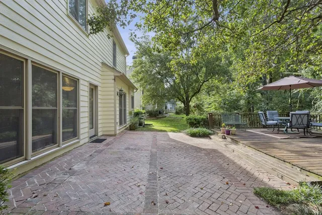 a view of balcony with outdoor seating and wooden floor