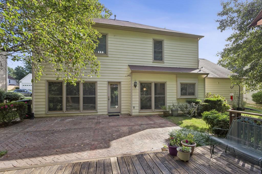 4815 Tanners Spring Drive Alpharetta, GA 30022 - Photo 36 of 45 a front view of a house with garden
