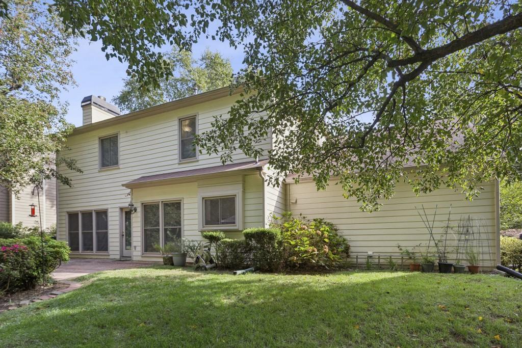 4815 Tanners Spring Drive Alpharetta, GA 30022 - Photo 38 of 45 a front view of a house with a garden