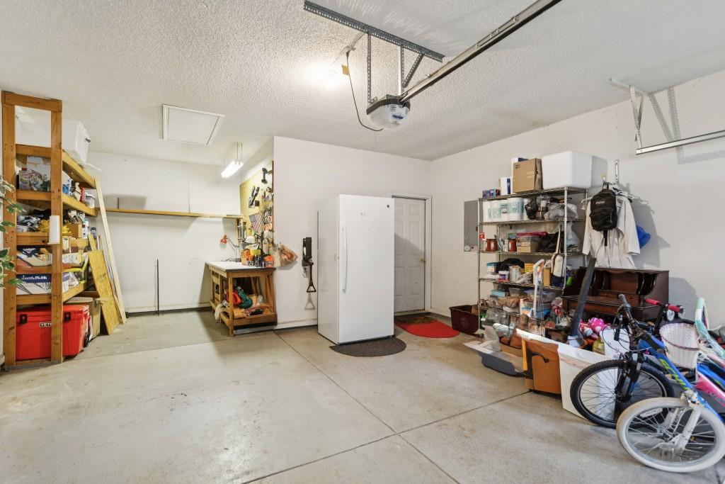 4815 Tanners Spring Drive Alpharetta, GA 30022 - Photo 41 of 45 a view of a garage with a bike and car