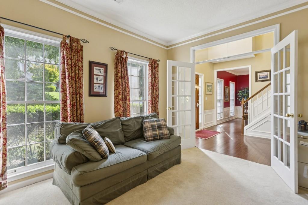 4815 Tanners Spring Drive Alpharetta, GA 30022 - Photo 6 of 45 a living room with furniture and a large window