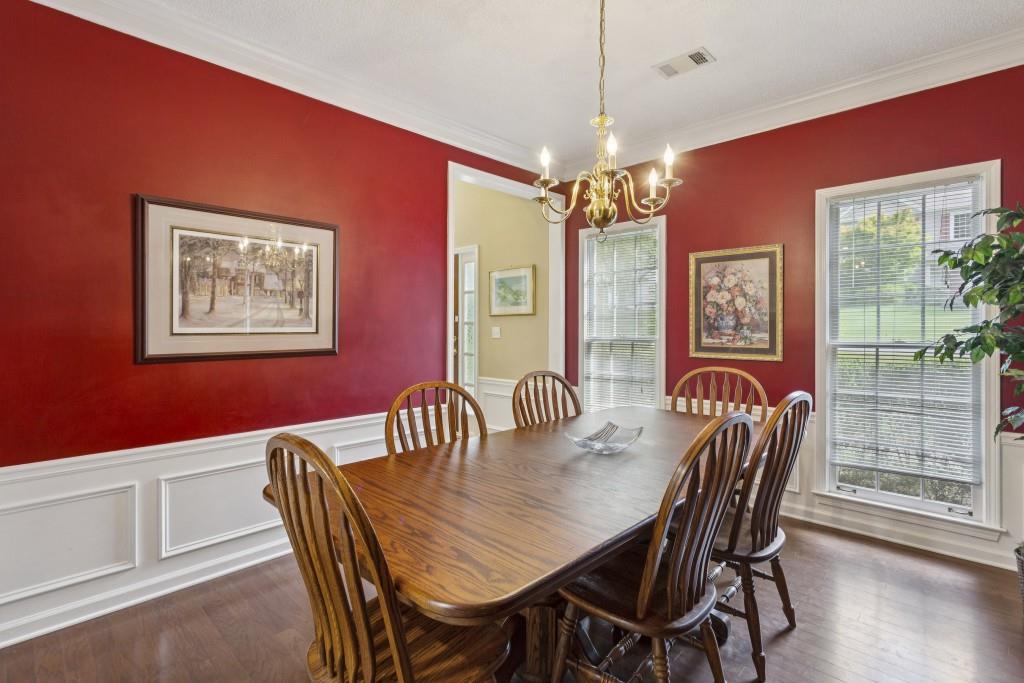 4815 Tanners Spring Drive Alpharetta, GA 30022 - Photo 8 of 45 a view of a dining room with furniture window and wooden floor