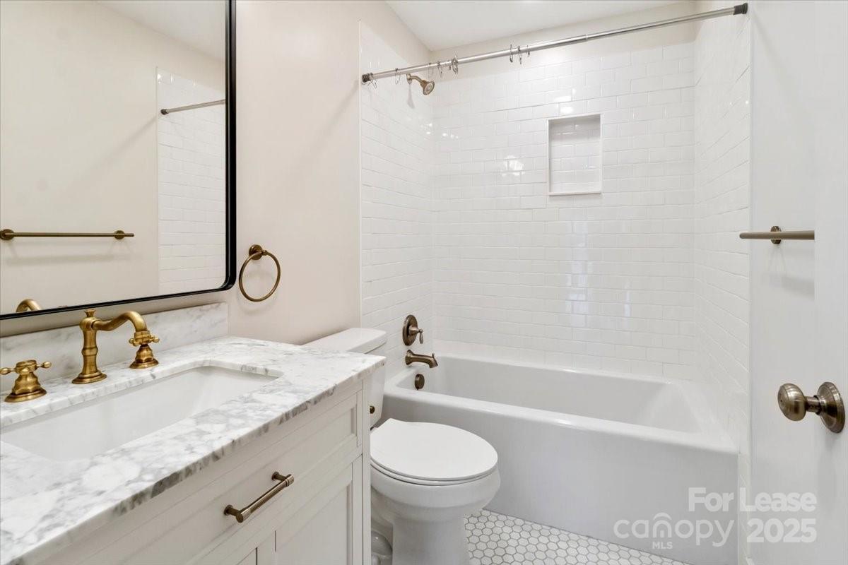756 Bailey Street Mars Hill, NC 28754 - Photo 15 of 23 a bathroom with a granite countertop sink toilet and shower