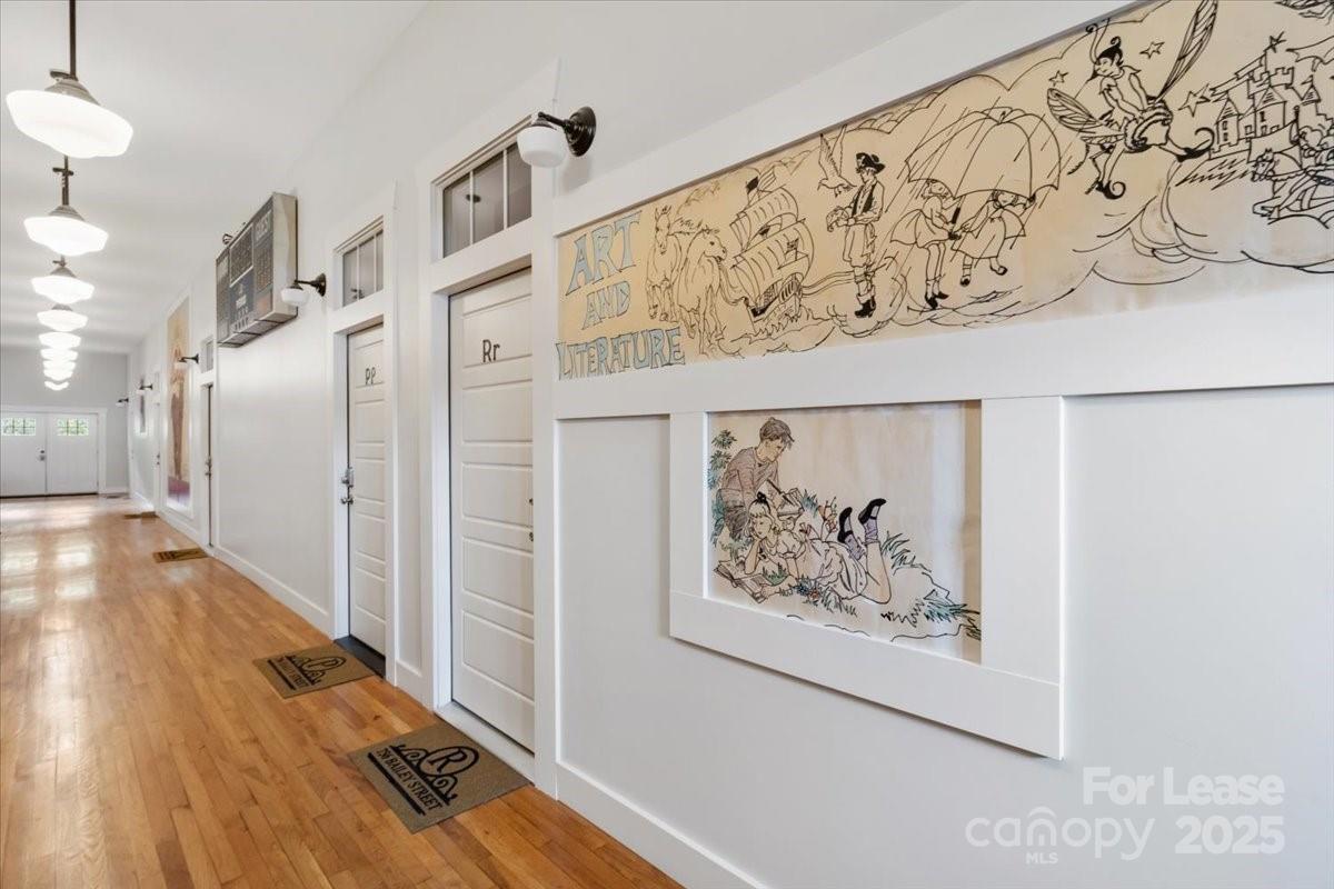 756 Bailey Street Mars Hill, NC 28754 - Photo 23 of 23 a view of a hallway with wooden floor and a living room
