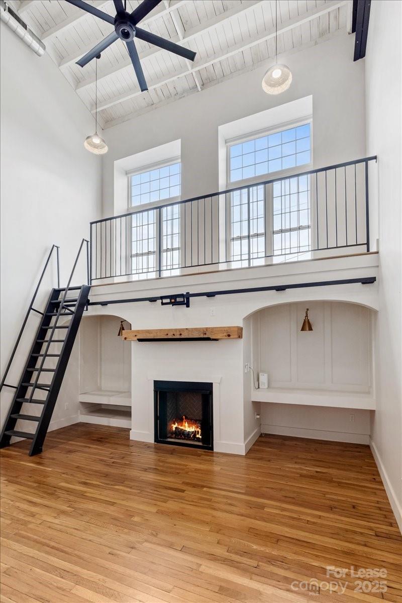 756 Bailey Street Mars Hill, NC 28754 - Photo 3 of 23 a view of an empty room with wooden floor fireplace and a window