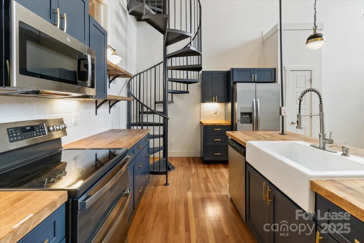 756 Bailey Street Mars Hill, NC 28754 - Photo 8 of 23 a kitchen with a sink appliances and cabinets