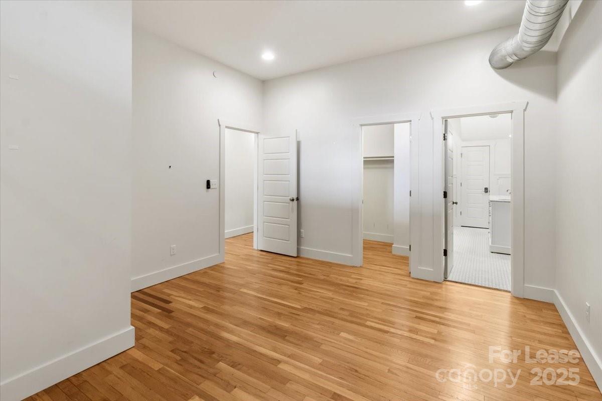 756 Bailey Street Mars Hill, NC 28754 - Photo 10 of 23 a view of an empty room with wooden floor and a window