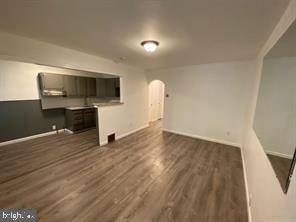 a view of a livingroom with furniture and a flat screen tv