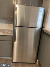 5522 Wheeler Street Philadelphia, PA 19143 - Photo 3 of 7 a close view of a refrigerator in kitchen