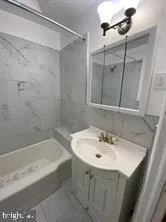 a bathroom with a sink and mirror