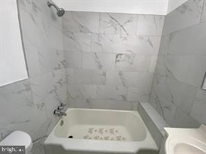 5522 Wheeler Street Philadelphia, PA 19143 - Photo 6 of 7 a bathroom with a bathtub