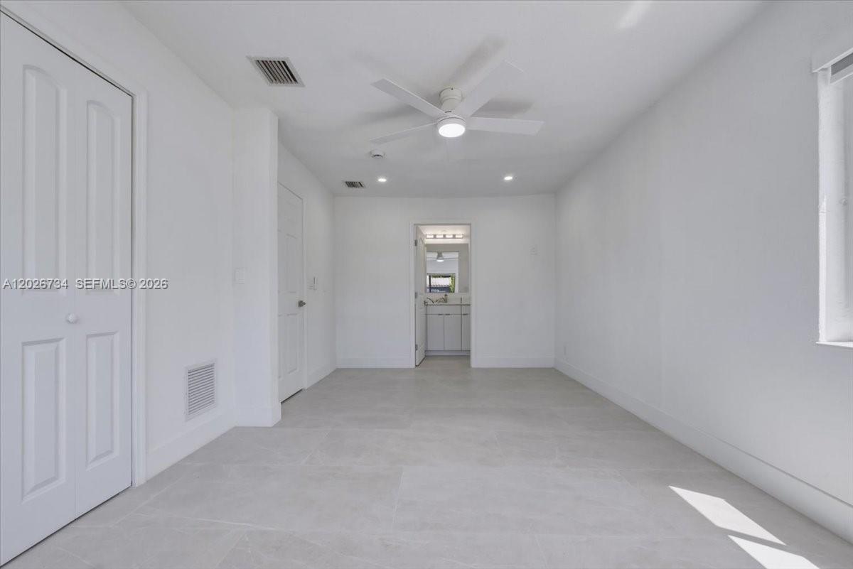266 Southwest 6th Street Dania Beach, FL 33004 - Photo 13 of 37 an empty room with a empty space and windows