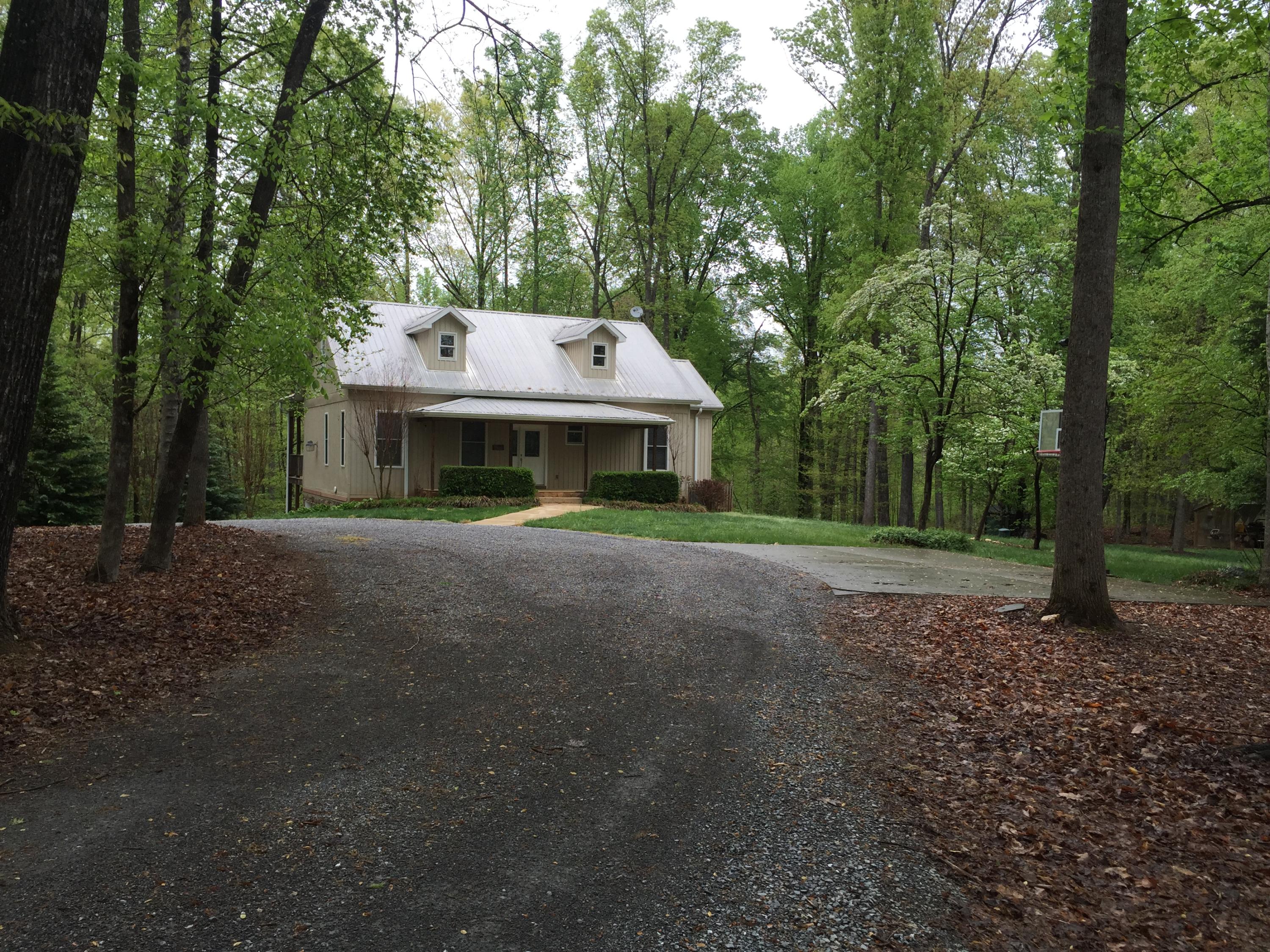 4560 White House Road Moneta, VA 24121 - Photo 3 of 17 a view of a house with large trees and large trees