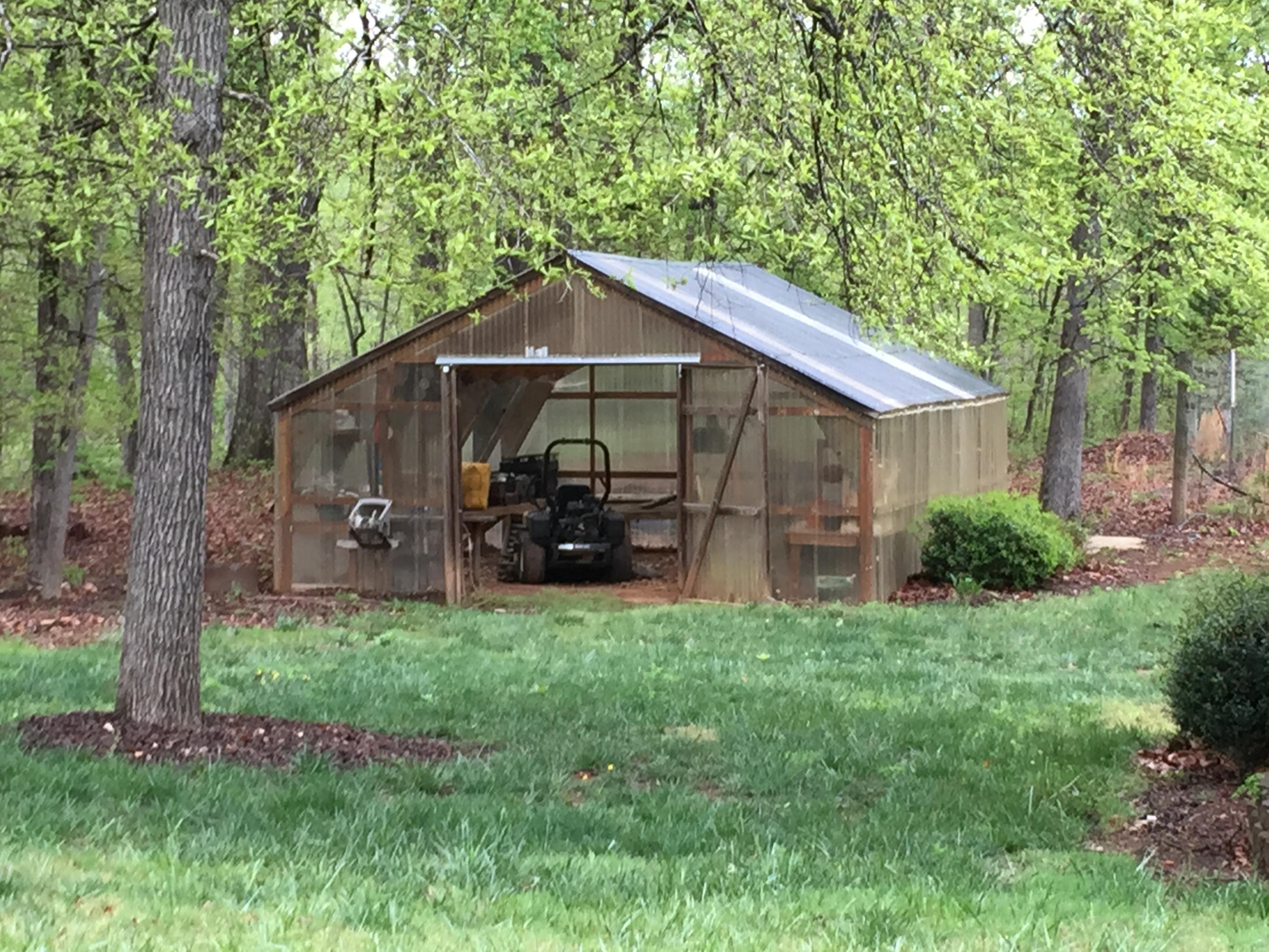 4560 White House Road Moneta, VA 24121 - Photo 5 of 17 a backyard of a house with table and chairs a barbeque