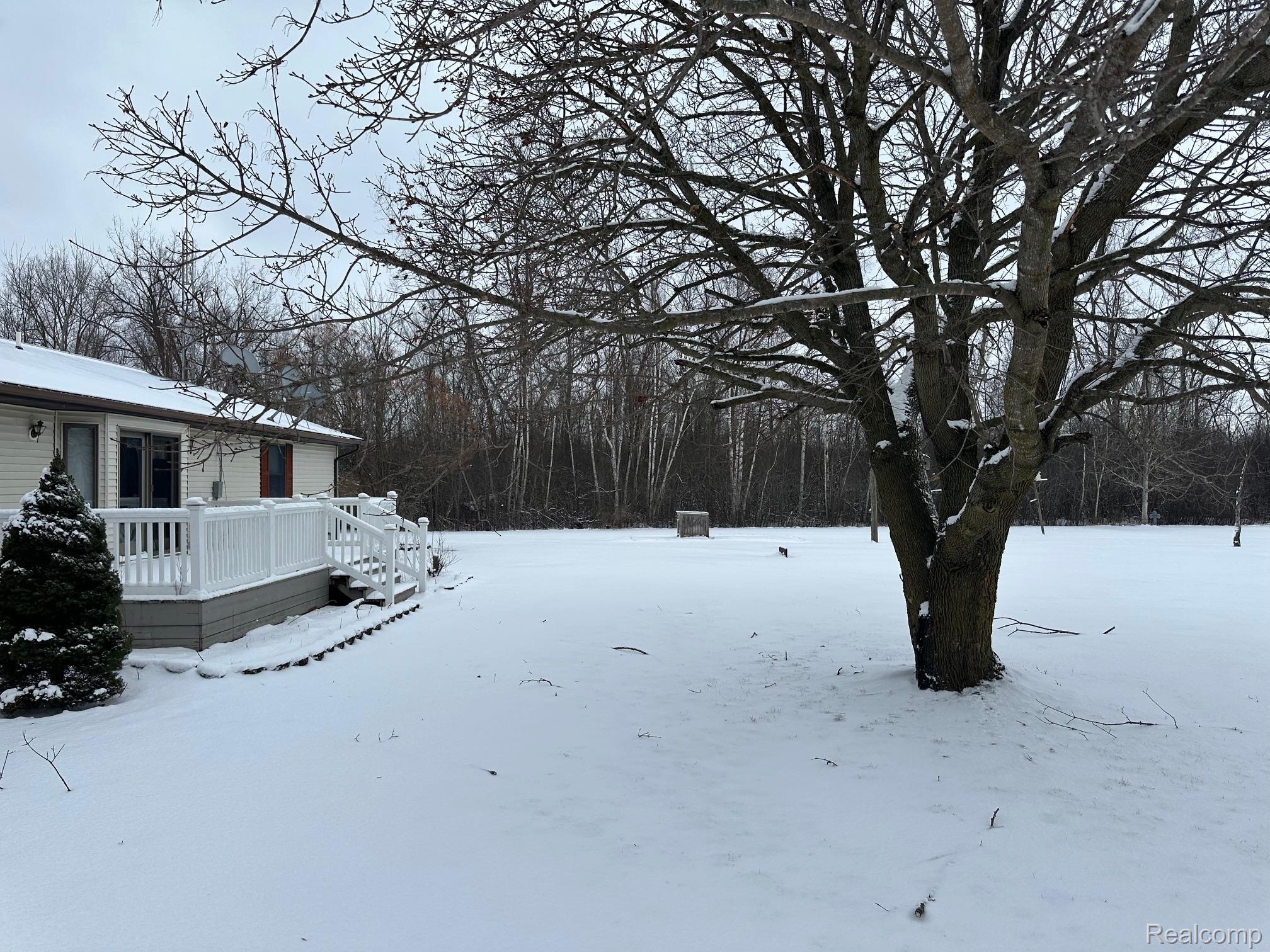 3803 Warner Road Cass City, MI 48726 - Photo 77 of 85 Snowy yard with a wooden deck