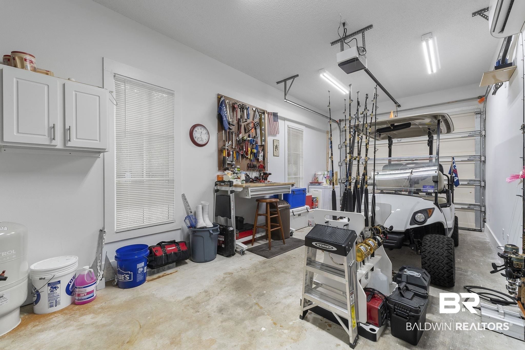 4451 Millhouse Road Gulf Shores, AL 36542 - Photo 41 of 50 Garage with a garage door opener