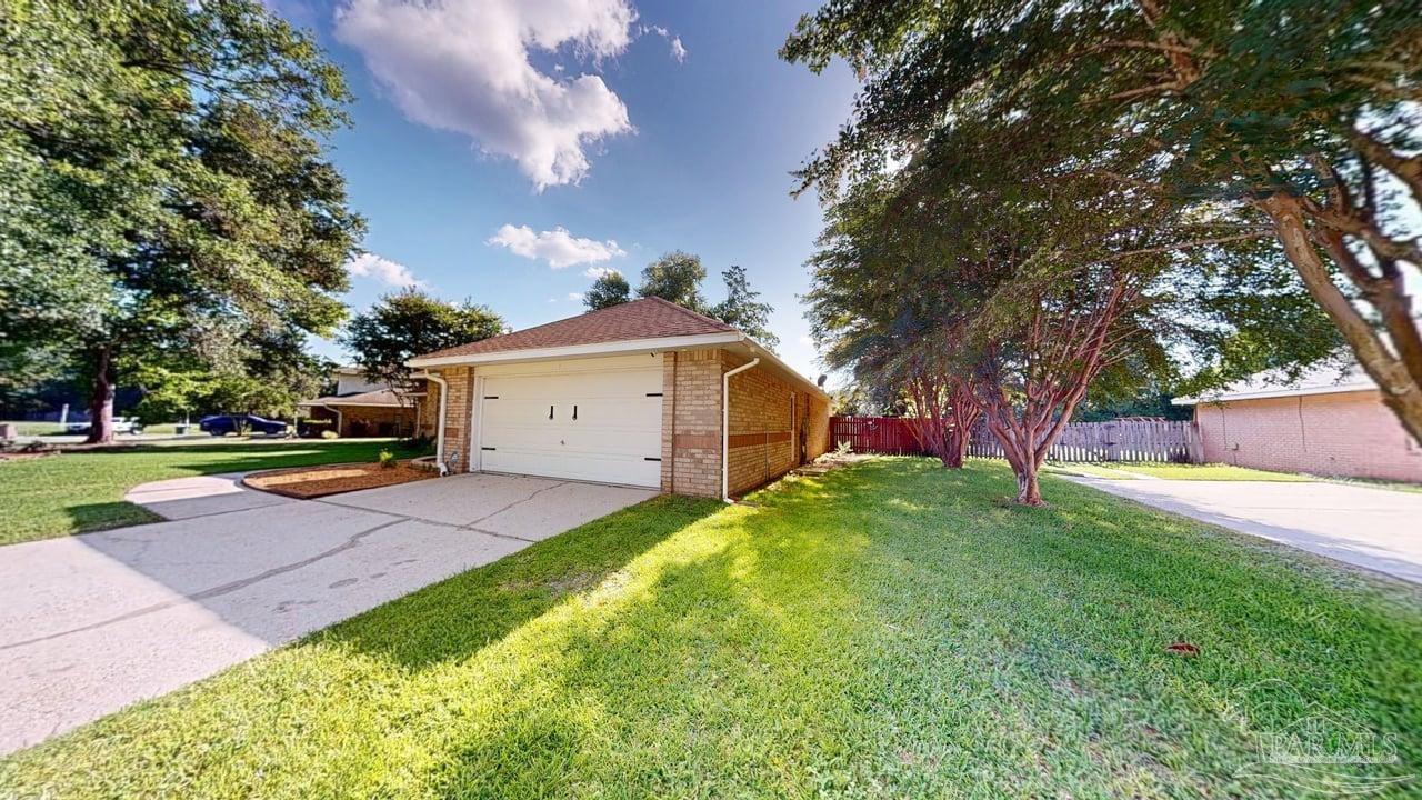 10111 Bristol Park Road Cantonment, FL 32533 - Photo 2 of 72 a view of a house with a yard and tree s