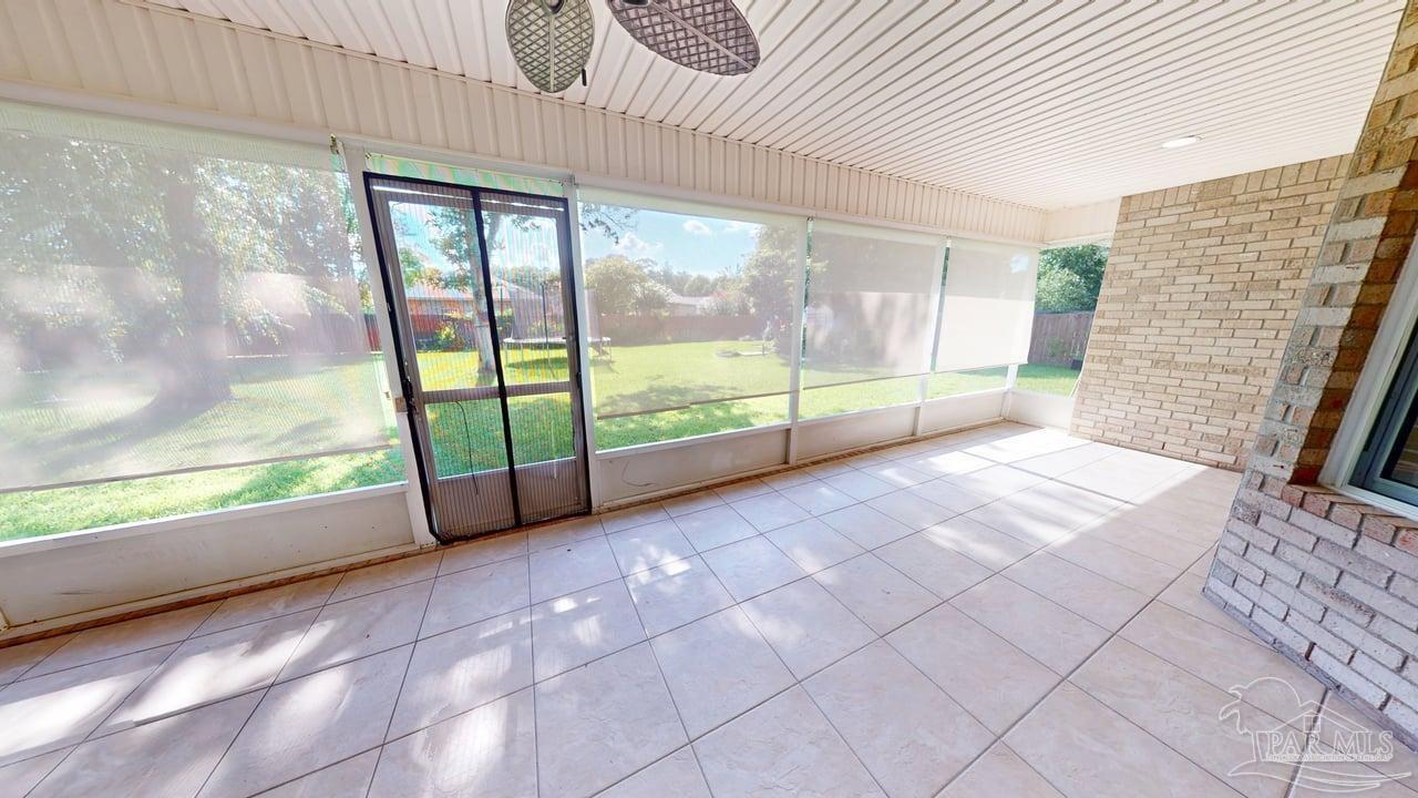 10111 Bristol Park Road Cantonment, FL 32533 - Photo 26 of 72 a view of an empty room with windows