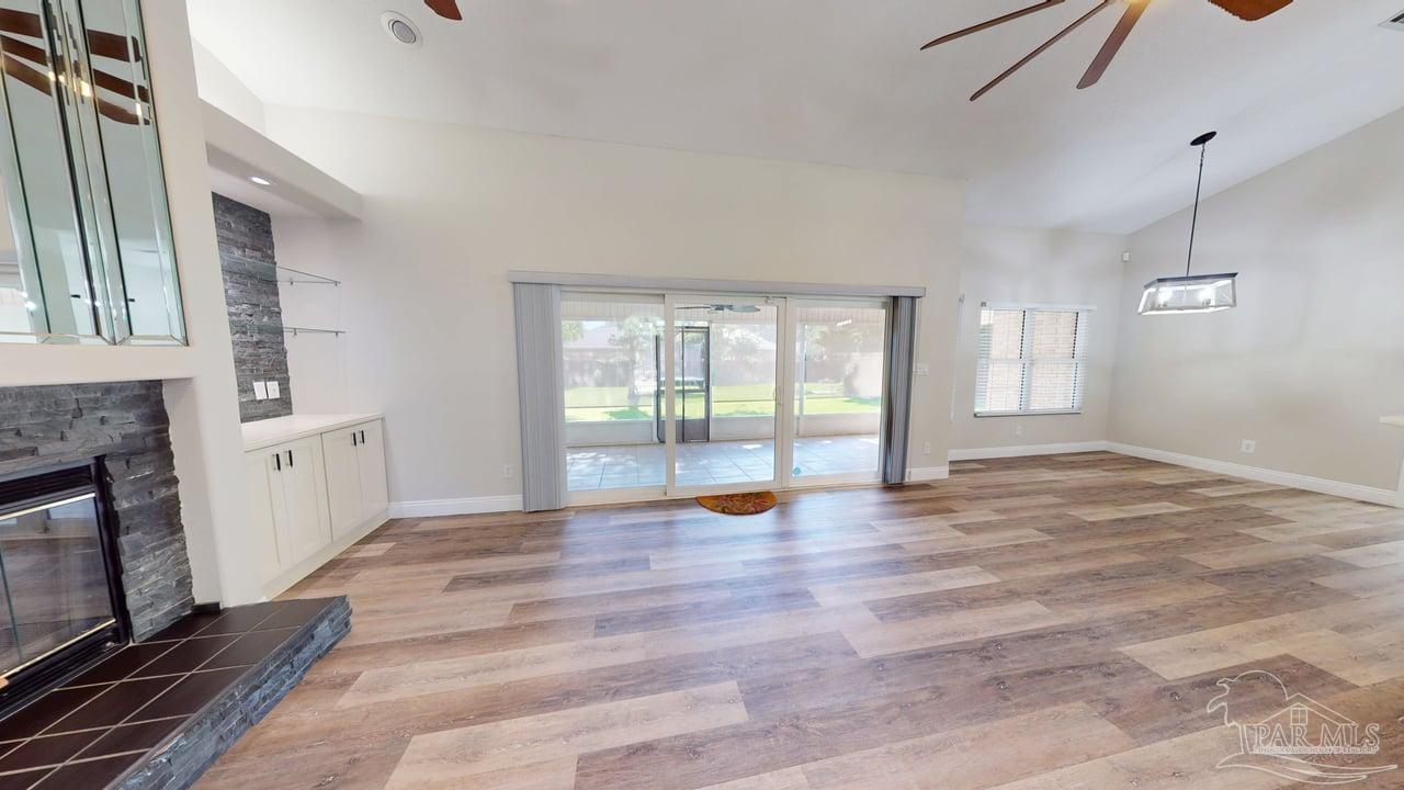 10111 Bristol Park Road Cantonment, FL 32533 - Photo 32 of 72 a view of an empty room with window and wooden floor