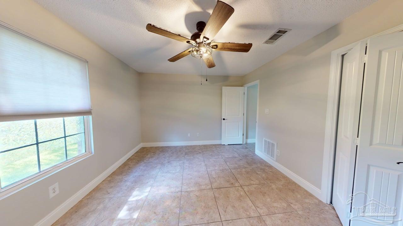 10111 Bristol Park Road Cantonment, FL 32533 - Photo 34 of 72 a view of an empty room with a window