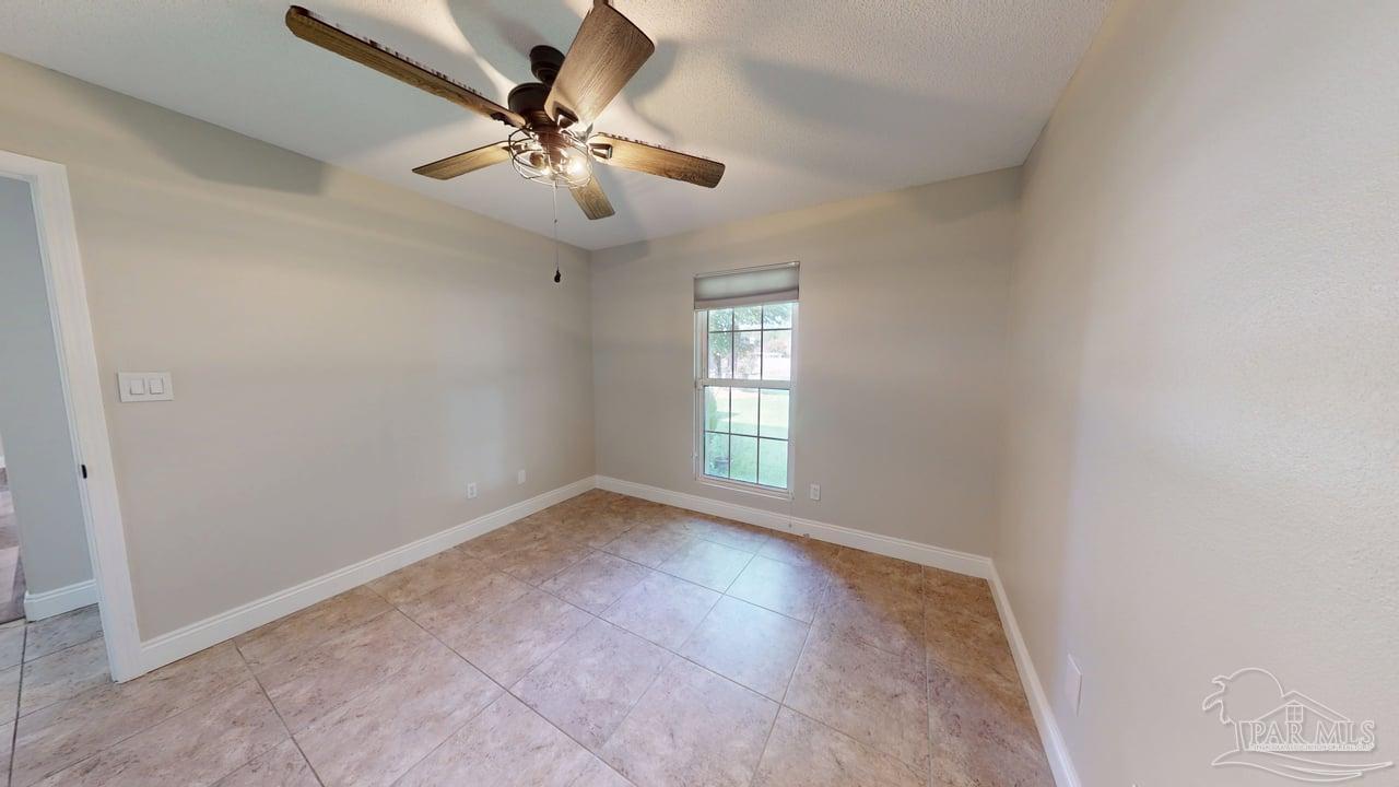 10111 Bristol Park Road Cantonment, FL 32533 - Photo 38 of 72 wooden floor in an empty room with a window