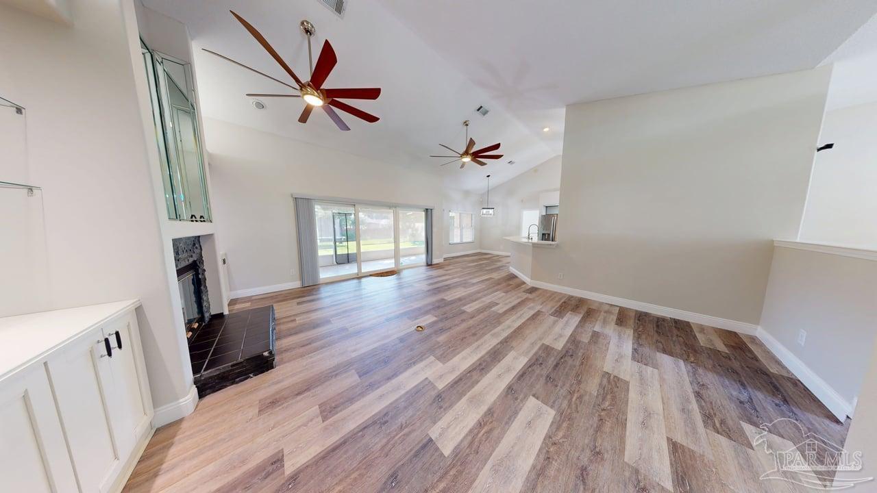 10111 Bristol Park Road Cantonment, FL 32533 - Photo 42 of 72 wooden floor in an empty room with a window