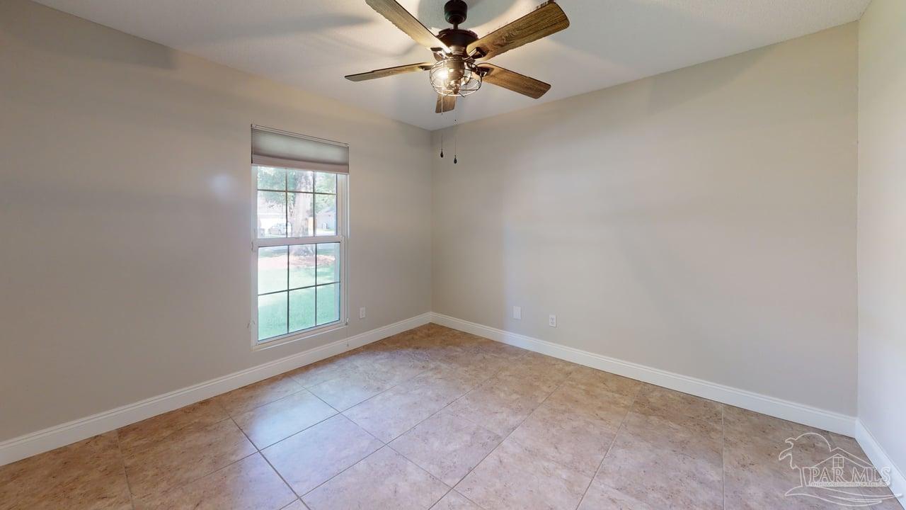 10111 Bristol Park Road Cantonment, FL 32533 - Photo 50 of 72 an empty room with windows and fan