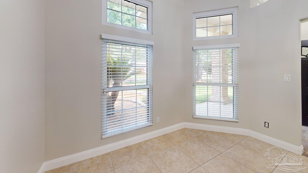 10111 Bristol Park Road Cantonment, FL 32533 - Photo 57 of 72 an empty room with windows