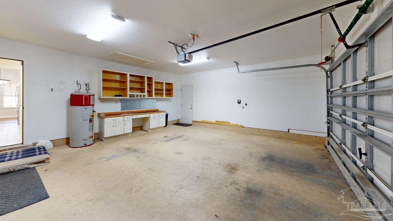 10111 Bristol Park Road Cantonment, FL 32533 - Photo 59 of 72 a big room with wooden floors and windows