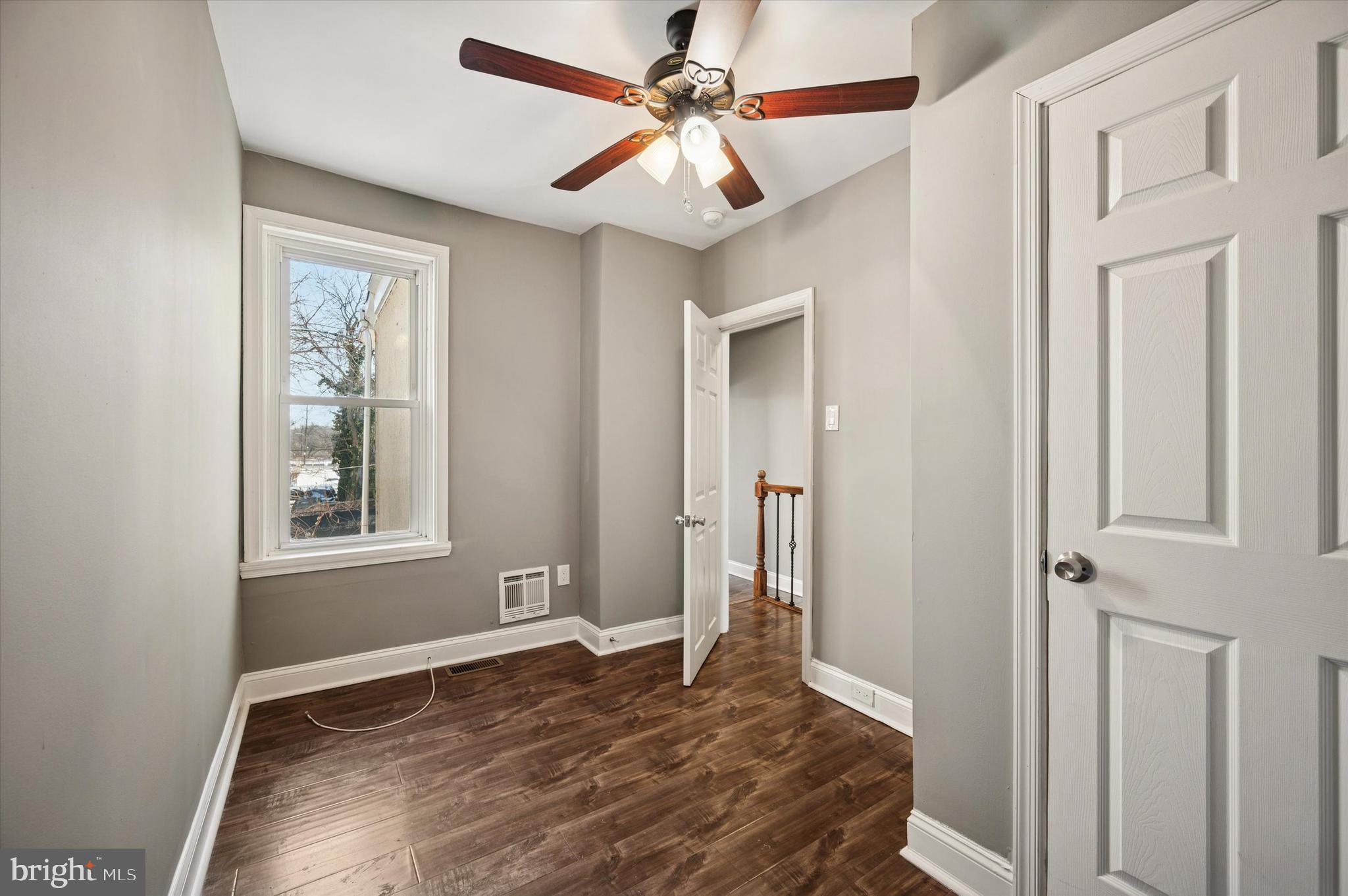 2147 North Marston Street Philadelphia, PA 19121 - Photo 13 of 15 a bedroom with a bed and a window