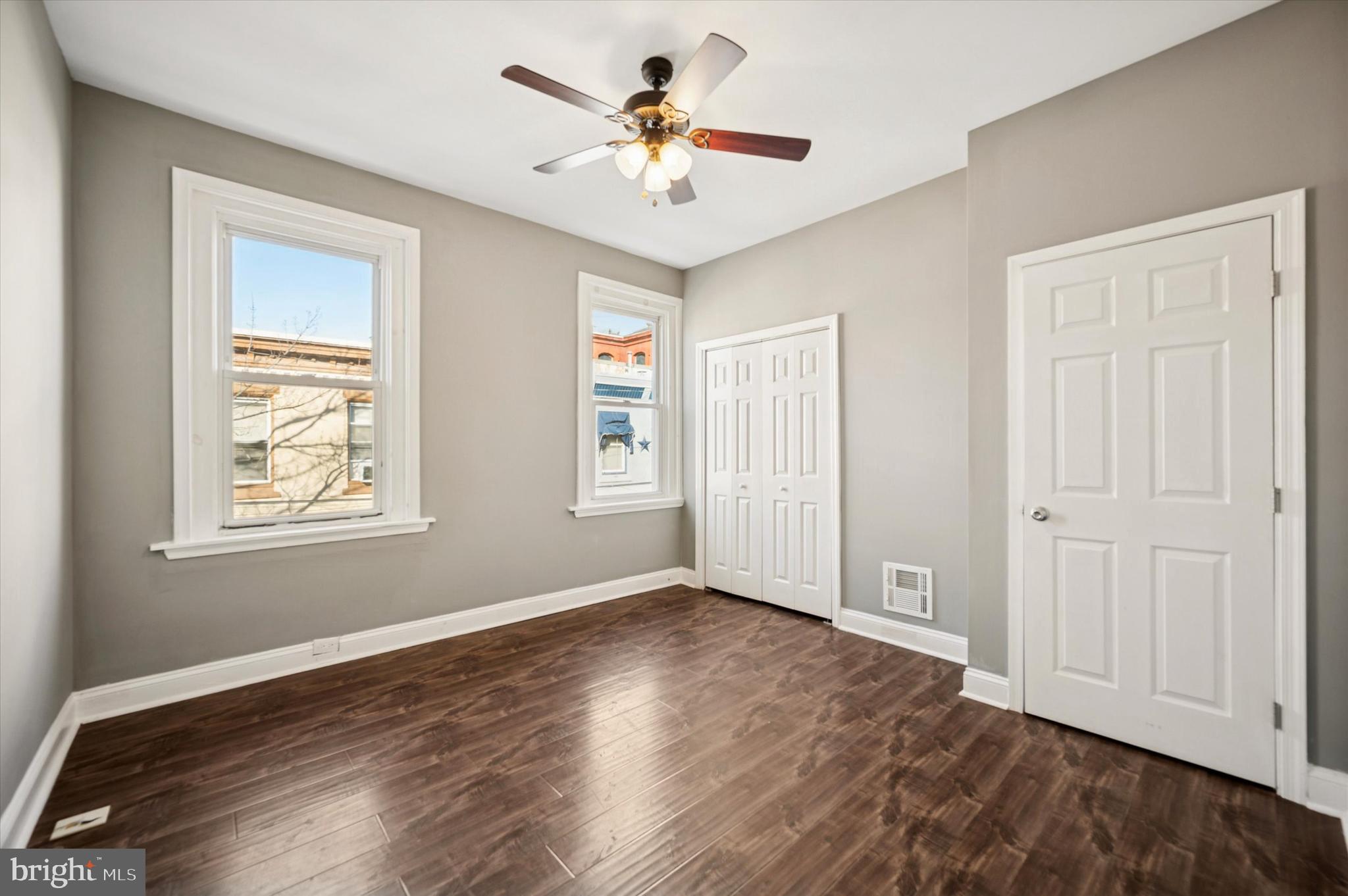 2147 North Marston Street Philadelphia, PA 19121 - Photo 14 of 15 wooden floor in an empty room with a window