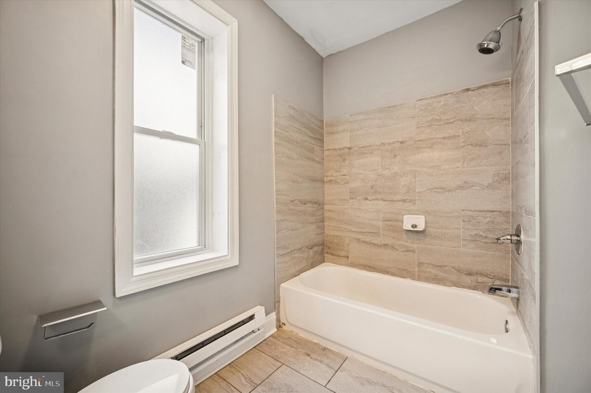 2147 North Marston Street Philadelphia, PA 19121 - Photo 6 of 15 a bathroom with a bathtub and a toilet