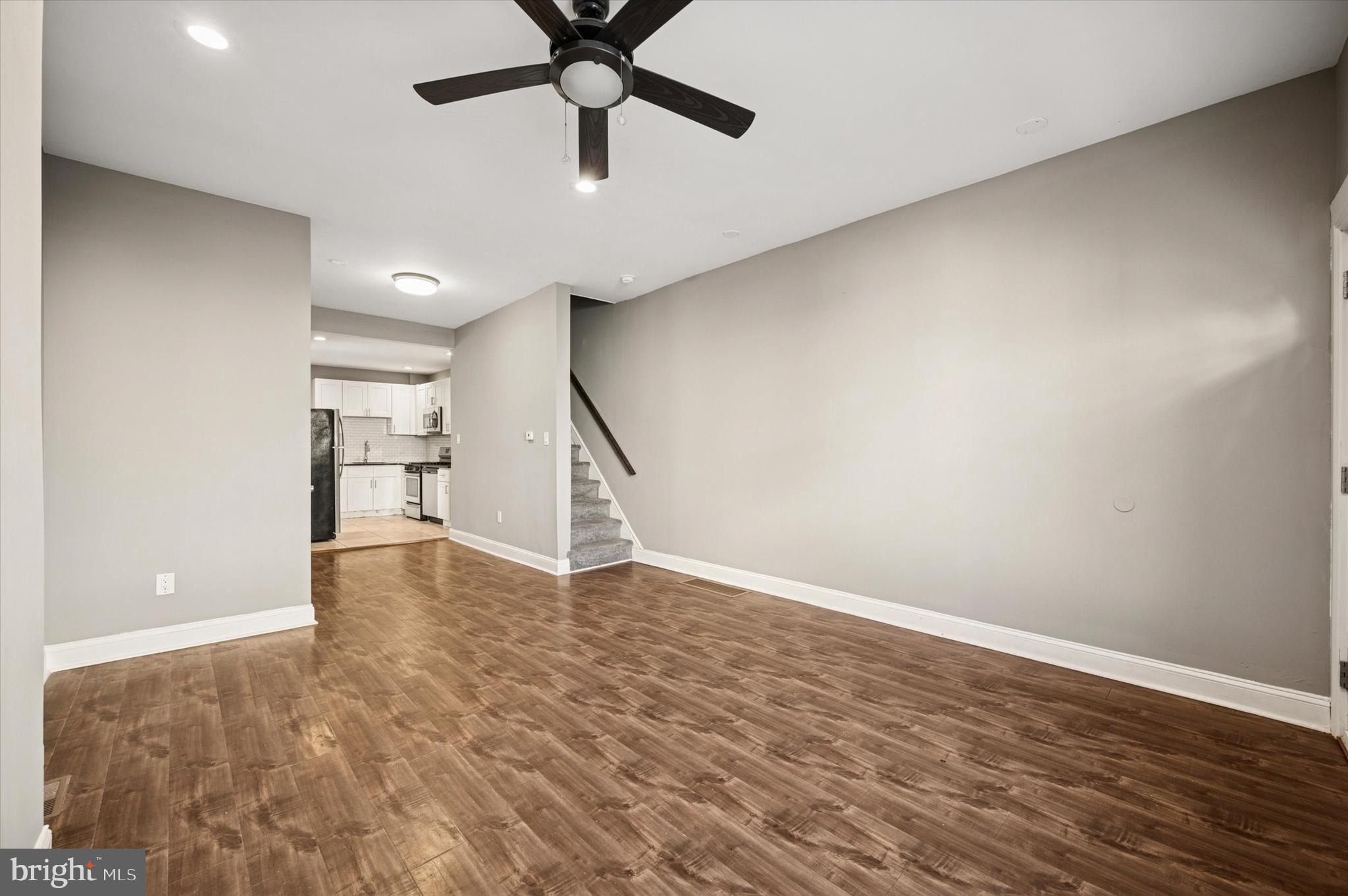 2147 North Marston Street Philadelphia, PA 19121 - Photo 7 of 15 an empty room with wooden floor and windows