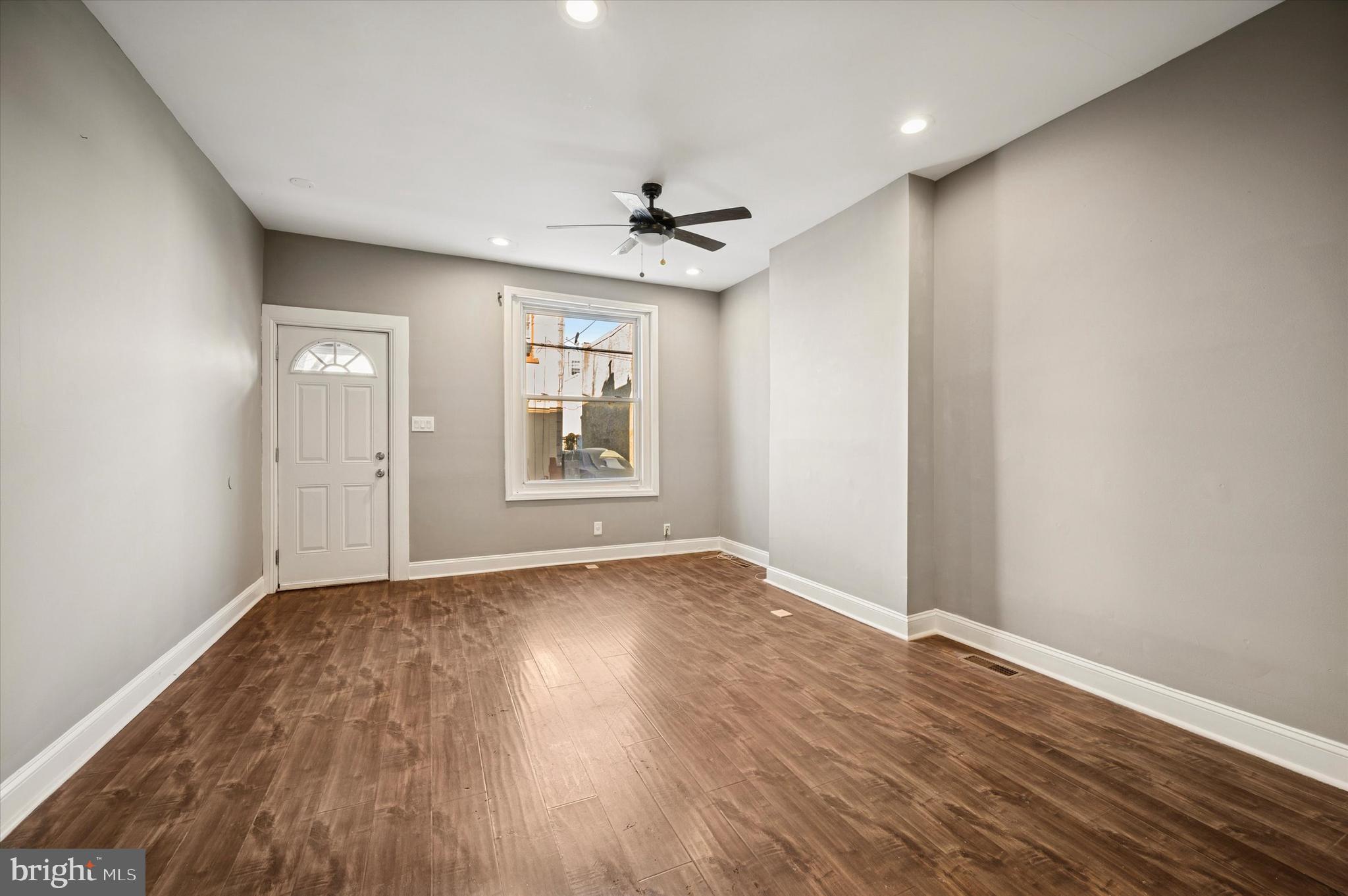 2147 North Marston Street Philadelphia, PA 19121 - Photo 8 of 15 wooden floor in an empty room with a window