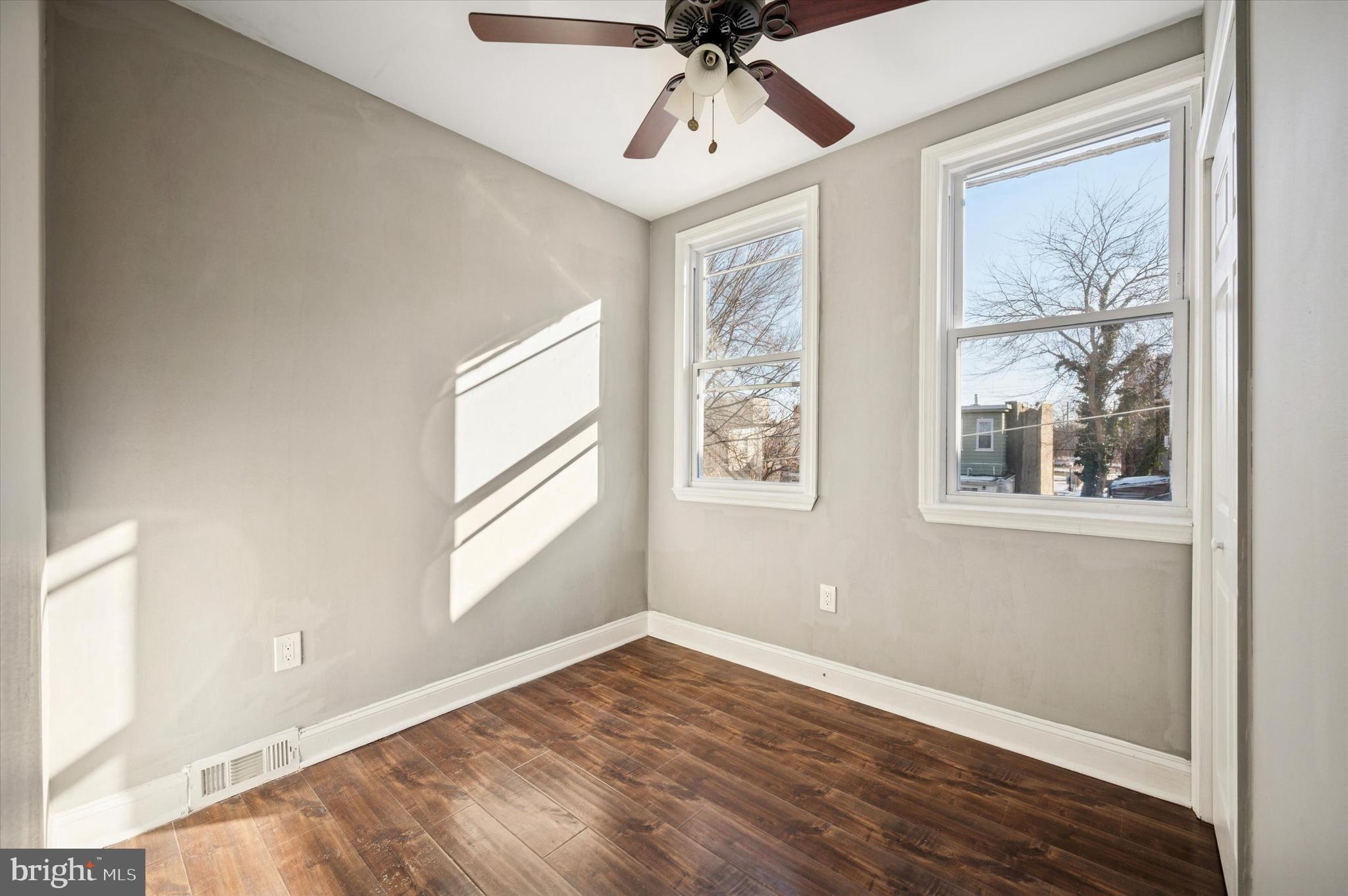 2147 North Marston Street Philadelphia, PA 19121 - Photo 10 of 15 a view of empty room with wooden floor and fan