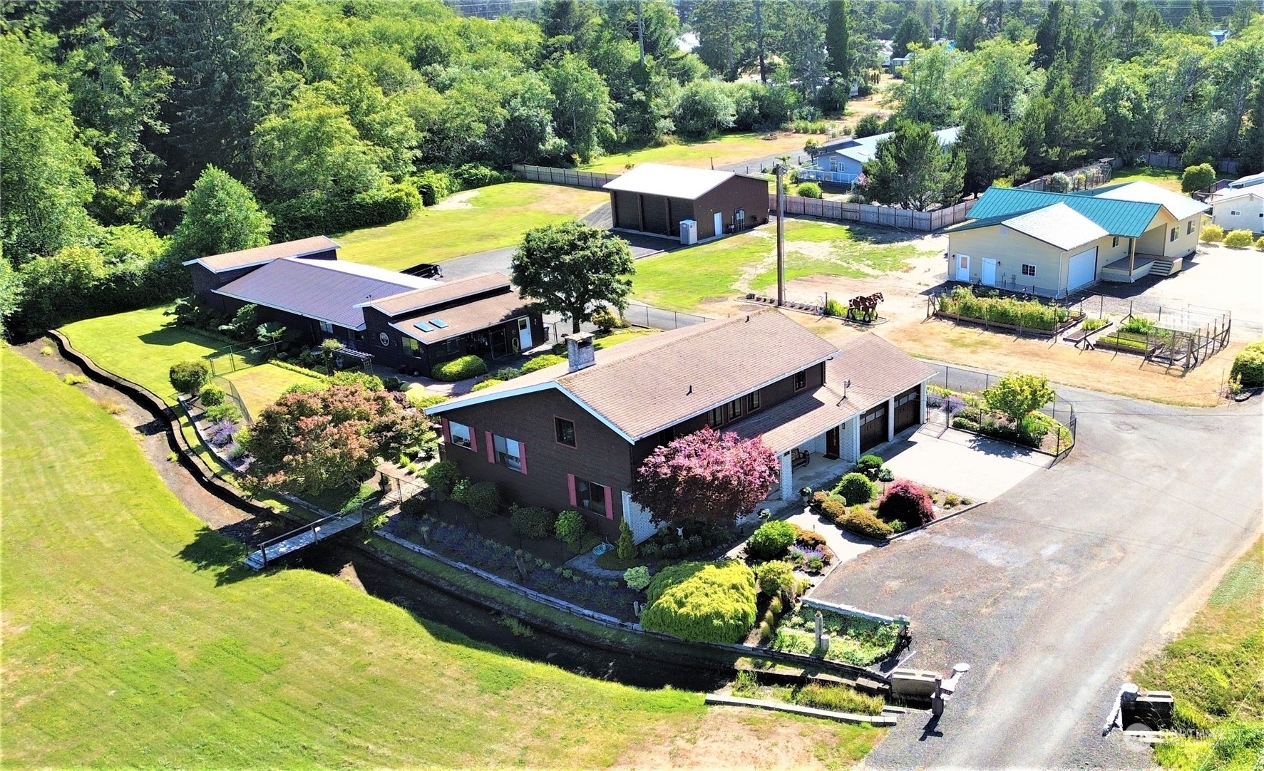 an aerial view of a house with a garden