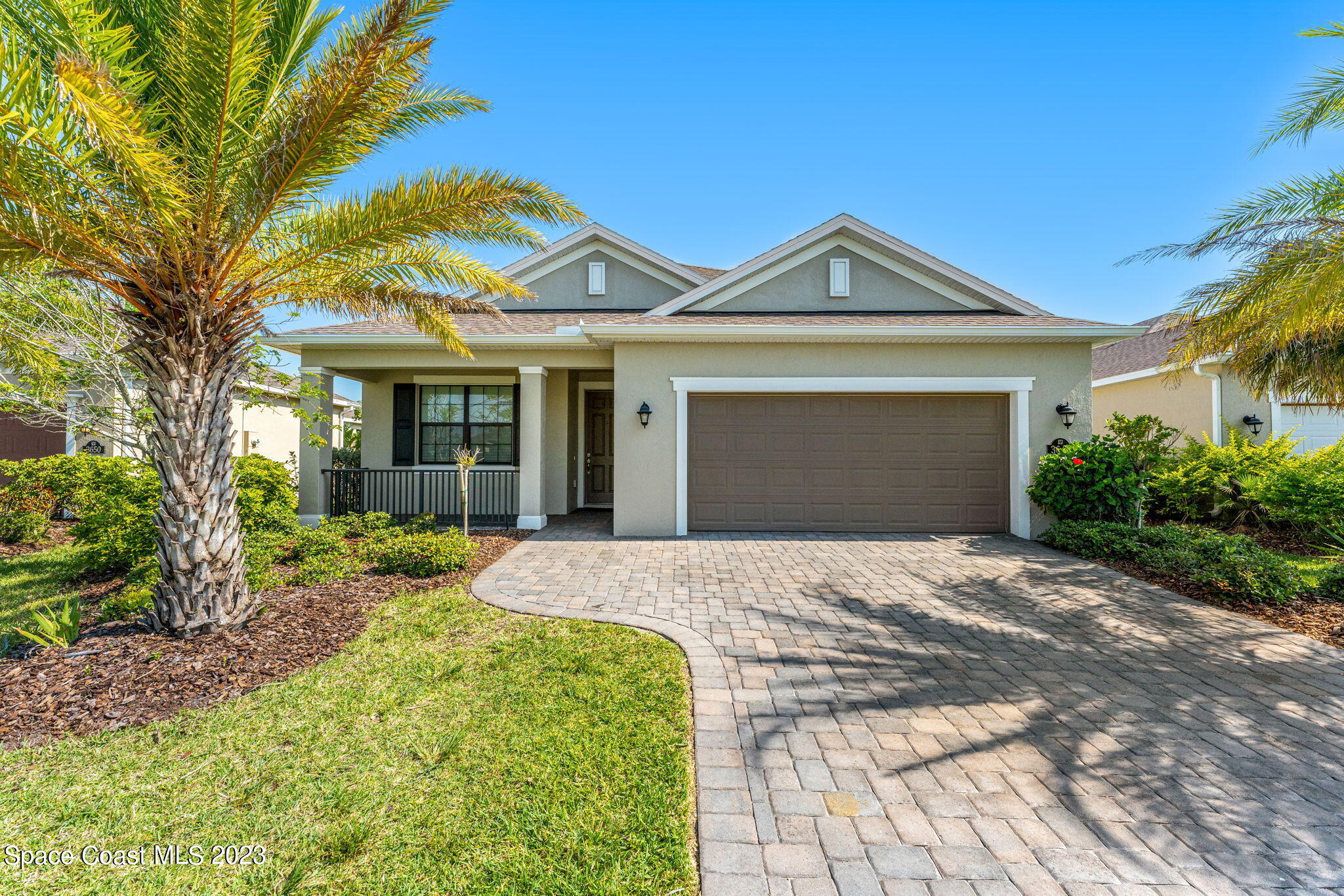 3640 Stabane Place Melbourne, FL 32940 - Photo 2 of 85 a front view of a house with garden