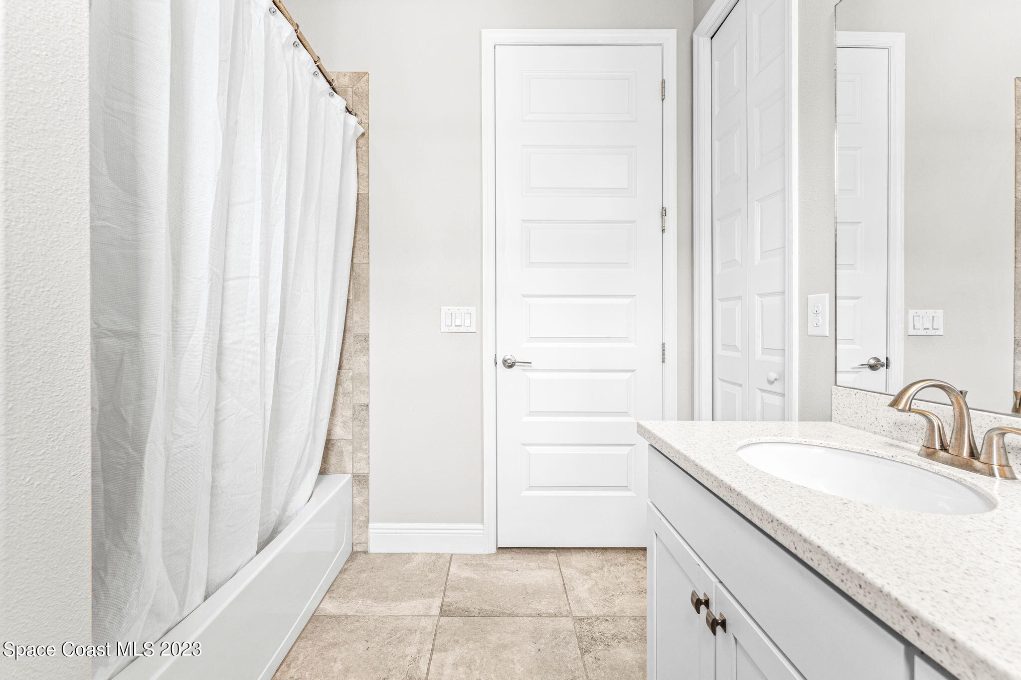 3640 Stabane Place Melbourne, FL 32940 - Photo 28 of 85 a bathroom with a sink and a mirror