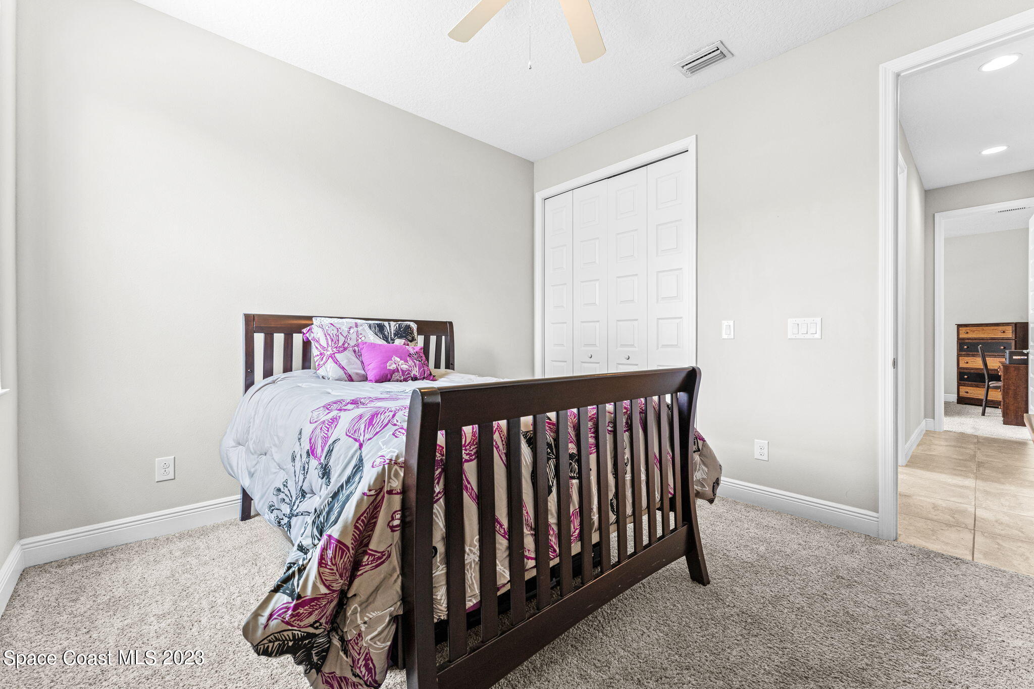 3640 Stabane Place Melbourne, FL 32940 - Photo 32 of 85 a bedroom with a bed and a window