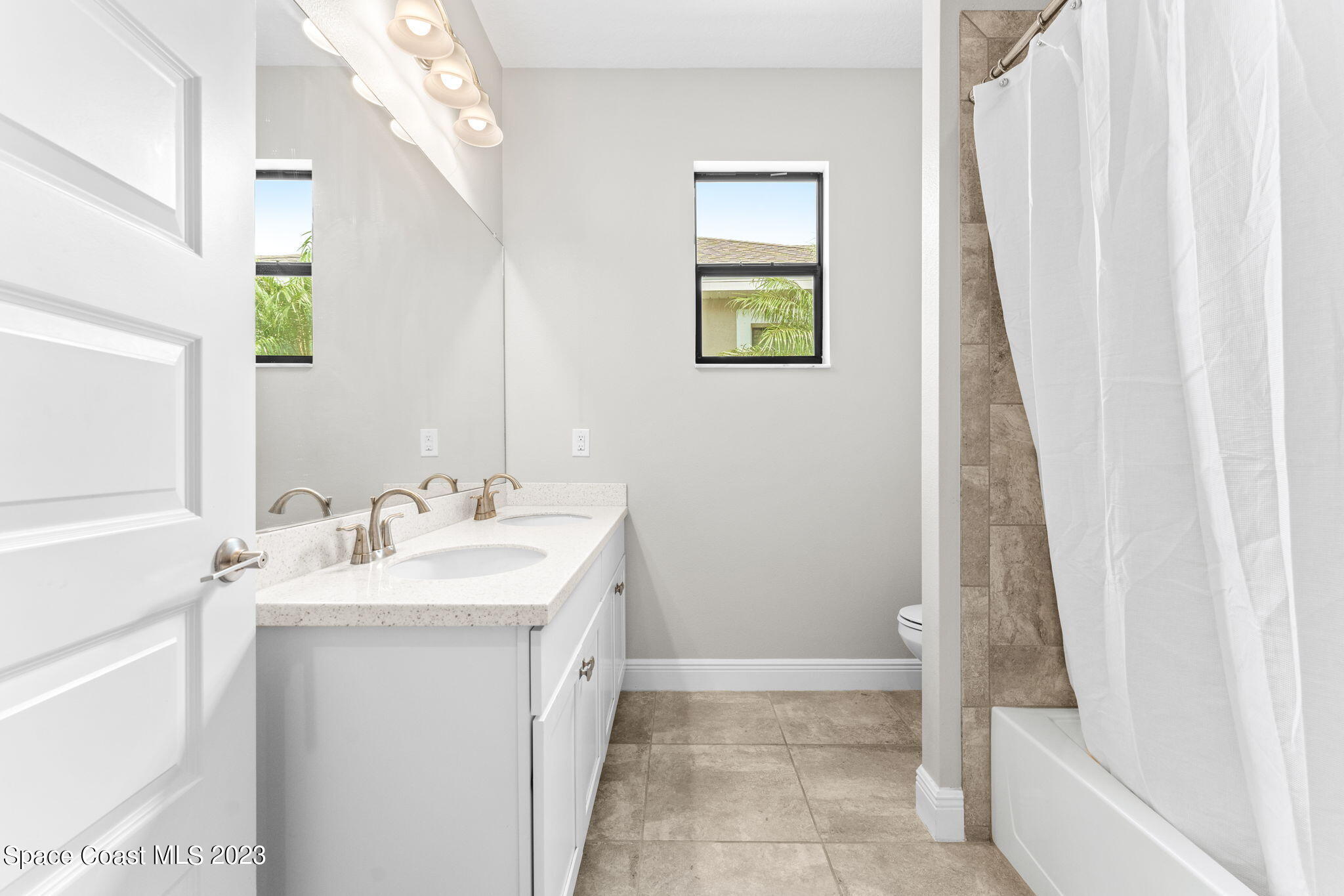 3640 Stabane Place Melbourne, FL 32940 - Photo 34 of 85 a bathroom with a sink a vanity and a mirror