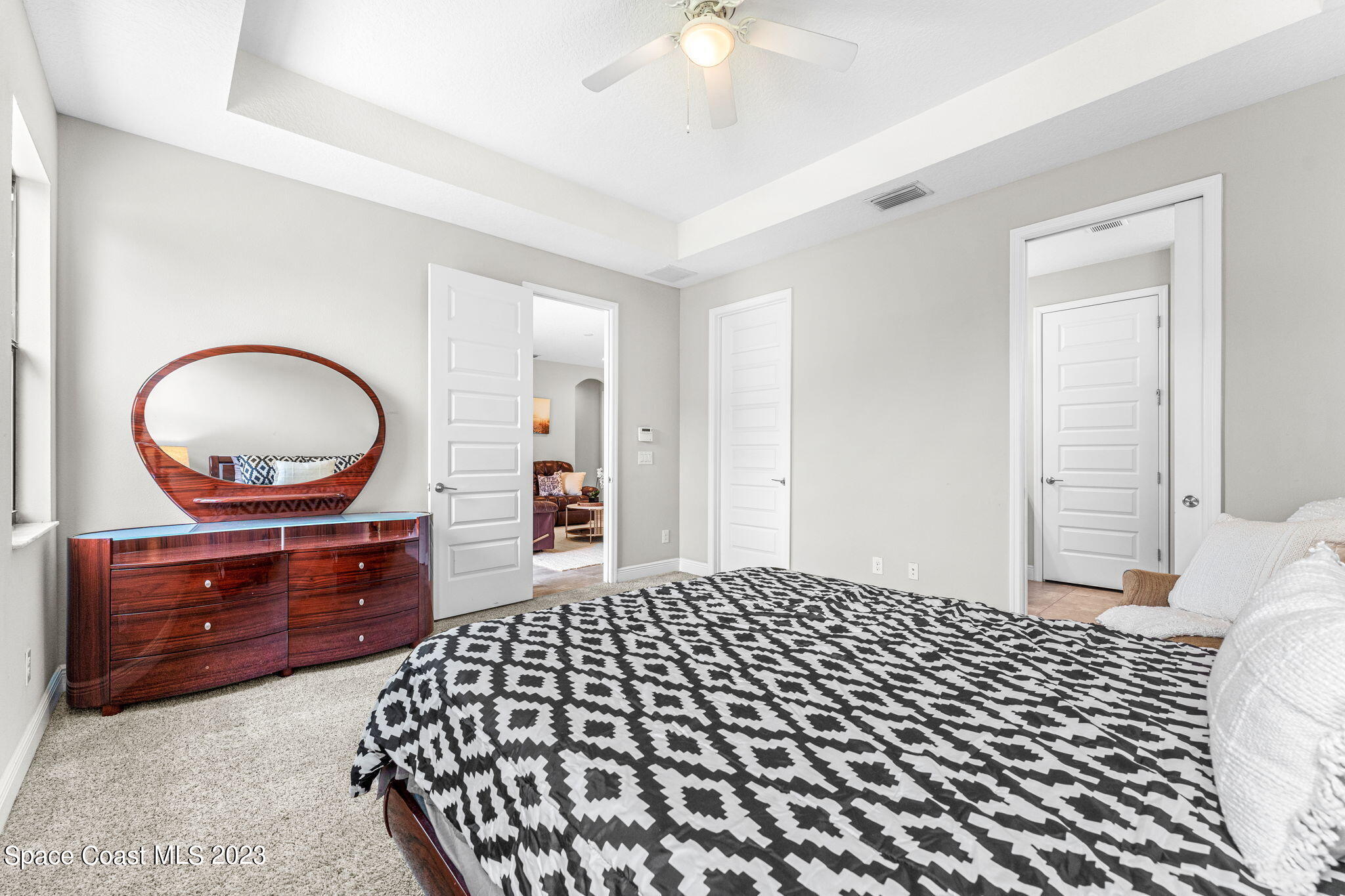 3640 Stabane Place Melbourne, FL 32940 - Photo 39 of 85 a bedroom with a bed and a dresser