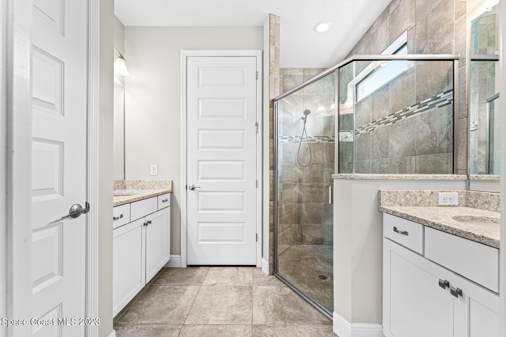 3640 Stabane Place Melbourne, FL 32940 - Photo 41 of 85 a bathroom with a shower and a sink